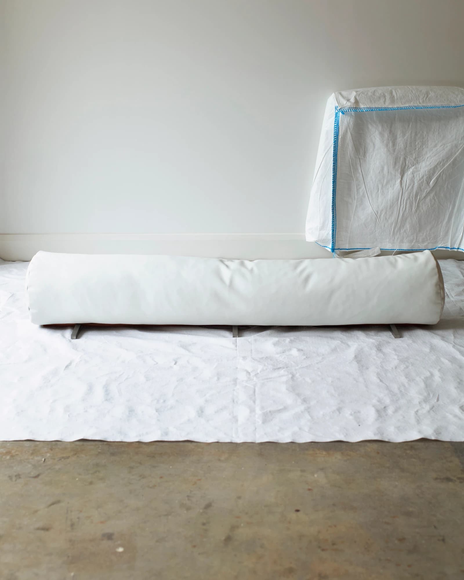 The Architectural Completion of a Floor Bolster Cushion – White